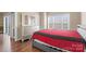 Bright bedroom featuring a window and a silver dresser and mirror at 8923 Meadow Vista Rd, Charlotte, NC 28213