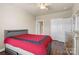 Comfortable bedroom features a ceiling fan, walk-in closet, and neutral paint at 8923 Meadow Vista Rd, Charlotte, NC 28213