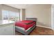 Bright bedroom with a large window and modern gray bed frame at 8923 Meadow Vista Rd, Charlotte, NC 28213