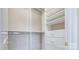 Spacious walk-in closet with custom built-in shelving and storage drawers at 8923 Meadow Vista Rd, Charlotte, NC 28213