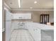 Well-lit kitchen featuring white cabinetry and modern appliances at 8923 Meadow Vista Rd, Charlotte, NC 28213