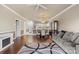 Inviting open-concept living room with a fireplace, modern decor, and hardwood floors at 8923 Meadow Vista Rd, Charlotte, NC 28213
