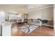 A cozy living room featuring neutral tones, hardwood floors, and a comfortable sofa at 8923 Meadow Vista Rd, Charlotte, NC 28213