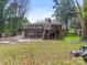 View of the back of the house showing a deck and garage at 911 E Woodlawn Rd, Charlotte, NC 28209