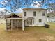 Rear exterior view featuring a covered porch, a screened porch and siding at 9203 Christina Marie Ct, Charlotte, NC 28213