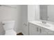 Bathroom with a white toilet, vanity, mirror and tile surround tub at 9203 Christina Marie Ct, Charlotte, NC 28213