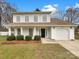 Charming two-story home with a well-manicured lawn and a classic white exterior at 9203 Christina Marie Ct, Charlotte, NC 28213