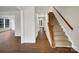 Bright foyer with wood floors and staircase at 9203 Christina Marie Ct, Charlotte, NC 28213