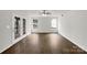 Open living room featuring natural light and wood floors at 9203 Christina Marie Ct, Charlotte, NC 28213