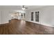 Open concept living room with kitchen and doors to the backyard at 9203 Christina Marie Ct, Charlotte, NC 28213