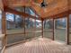 Relaxing sunroom featuring a ceiling fan and backyard views at 9203 Christina Marie Ct, Charlotte, NC 28213