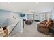 Spacious bonus room with plush carpeting, ceiling fan, and comfortable seating, perfect for relaxing or entertaining at 1008 Hills Oak Ln, Charlotte, NC 28269