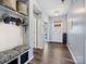 Well-organized hallway with custom storage, wood floors, and bright, neutral decor at 1008 Hills Oak Ln, Charlotte, NC 28269