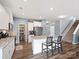Modern kitchen featuring granite countertops, stainless steel appliances, a large island, and a walk-in pantry at 1008 Hills Oak Ln, Charlotte, NC 28269