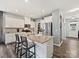 Bright kitchen with granite counters, stainless steel appliances, and a large island with bar stool seating at 1008 Hills Oak Ln, Charlotte, NC 28269