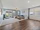 Spacious living room with a large sofa, and access to an outdoor patio, perfect for entertaining at 1008 Hills Oak Ln, Charlotte, NC 28269