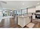 Open-concept living space with modern kitchen, hardwood floors, and cozy living room area at 1008 Hills Oak Ln, Charlotte, NC 28269
