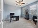 Comfortable office with natural light, neutral carpet and simple furnishings for an efficient workspace at 1008 Hills Oak Ln, Charlotte, NC 28269