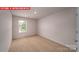 Bright and airy bedroom with plush carpeting, a large window, and neutral paint at 11217 Cardinal Creek Ave, Charlotte, NC 28215