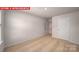 Neutral carpet, white walls, and an interior door are features of this light, airy bedroom at 11217 Cardinal Creek Ave, Charlotte, NC 28215