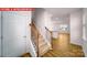 Bright entryway with wood-look flooring, staircase, and views into the open-concept living spaces at 11217 Cardinal Creek Ave, Charlotte, NC 28215