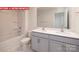 Bathroom showcasing double vanity sinks, modern fixtures, and stylish tile flooring at 11225 Cardinal Creek Ave, Charlotte, NC 28215