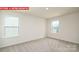 Comfortable bedroom with neutral carpet, bright windows, and ample natural light at 11225 Cardinal Creek Ave, Charlotte, NC 28215
