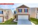 Charming two-story home with stone accents, a two-car garage, and a well-manicured lawn at 11225 Cardinal Creek Ave, Charlotte, NC 28215