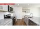 Well-equipped kitchen featuring stainless steel appliances, granite countertops, and gray cabinets at 11225 Cardinal Creek Ave, Charlotte, NC 28215