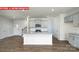 Open-concept kitchen featuring granite countertops, stainless steel appliances, and hardwood flooring at 11225 Cardinal Creek Ave, Charlotte, NC 28215