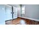 Bedroom featuring hardwood floors, two closets, neutral paint, and classic trim work at 113 Brawley St, Chester, SC 29706