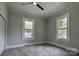 Neutral bedroom featuring carpet, a ceiling fan, and windows that let in lots of natural light at 113 Brawley St, Chester, SC 29706