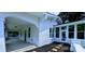 Charming white brick home with a covered porch and stepping stones at 113 Brawley St, Chester, SC 29706