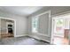 Carpeted living room with windows and doorways, offers seamless flow and lots of light at 113 Brawley St, Chester, SC 29706