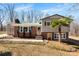 Classic home with brick and siding and a complementary green roof at 121 Alexis Forest Dr, Stanley, NC 28164