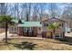 Charming home with a well-maintained lawn and a striking green roof at 121 Alexis Forest Dr, Stanley, NC 28164