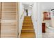 View of staircase and partial bathroom with cabinet and toilet at 121 Alexis Forest Dr, Stanley, NC 28164