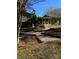 Charming backyard featuring a beautiful walkway, lush tropical plants and ample space for outdoor enjoyment at 121 Alexis Forest Dr, Stanley, NC 28164