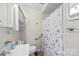 Cozy bathroom with tiled walls, essential fixtures, and a shower with a curtain at 121 Alexis Forest Dr, Stanley, NC 28164