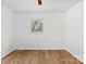 A light bedroom with hardwood floors and natural light through the window at 121 Alexis Forest Dr, Stanley, NC 28164