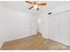 Bedroom featuring hardwood floors, a closet, and a ceiling fan at 121 Alexis Forest Dr, Stanley, NC 28164
