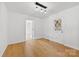 Bright dining room with a view of the front door with geometric panes and hardwood floors at 121 Alexis Forest Dr, Stanley, NC 28164