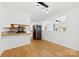 Bright dining room with open view of the kitchen featuring hardwood floors and stainless steel fridge at 121 Alexis Forest Dr, Stanley, NC 28164