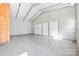 Bright garage interior showing metal framework, concrete floor, and ample storage capacity at 121 Alexis Forest Dr, Stanley, NC 28164