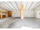 Large garage interior featuring metal framework, concrete floor, and unfinished loft space at 121 Alexis Forest Dr, Stanley, NC 28164