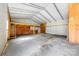 Spacious garage interior with high ceilings, metal frame and unfinished storage loft at 121 Alexis Forest Dr, Stanley, NC 28164