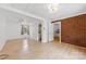 Open-concept living room with hardwood floors, ceiling fan, and natural light at 121 Alexis Forest Dr, Stanley, NC 28164