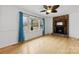 Bright living room with brick fireplace and a ceiling fan at 121 Alexis Forest Dr, Stanley, NC 28164