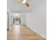 Spacious living room featuring wood floors, a ceiling fan, and large windows at 121 Alexis Forest Dr, Stanley, NC 28164