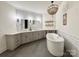 Luxurious bathroom with soaking tub, double vanity, and tile flooring at 12508 Asbury Chapel Rd, Huntersville, NC 28078